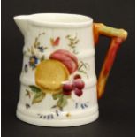 A c1960 Royal Worcester cream jug , decorated to side with fruit on a white ground ,