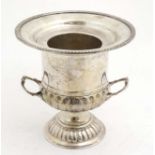 A silver plate ice bucket of campana urn form with lift out central section The whole 9 1/2" high