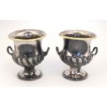 A pair of late 19thC / early 20thC silver plated small compana shaped twin handled urns with gilt