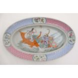 A Chinese famille rose dish decorated to centre with a dragon ,