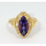 A Silver gilt ring set with central amethyst.