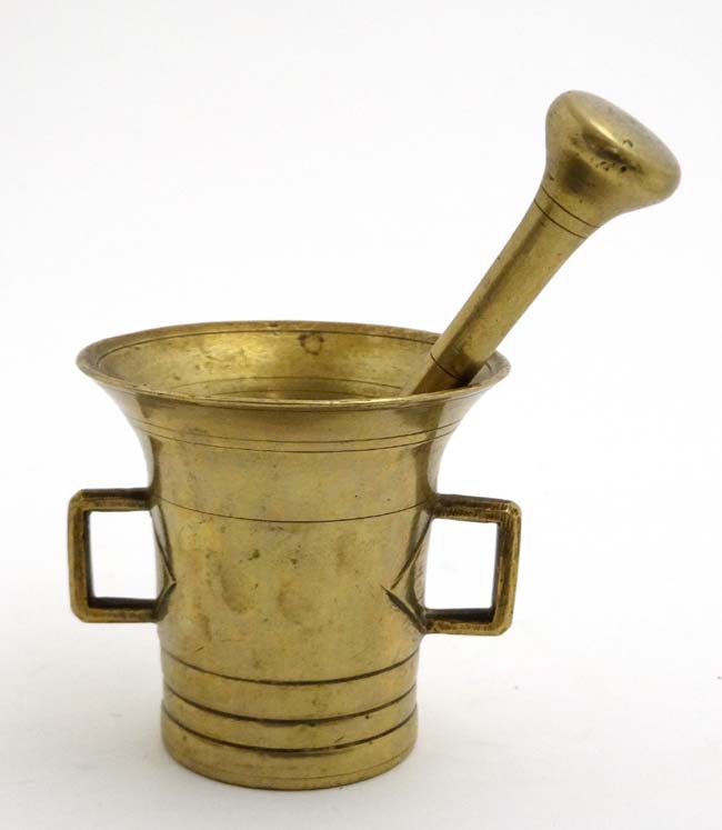 A 20thC brass two handled brass mortar and pestle. - Image 3 of 4