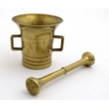 A 20thC brass two handled brass mortar and pestle.
