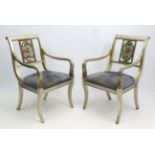 Mid Century / Hollywood Regency : A pair of silver gilt decorated Empire Style Elbow chairs with