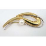 An 18ct white and yellow gold brooch set with pearl.