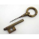 Novelty Cork Screw: a brass large key unscrewing to reveal a working corkscrew ,