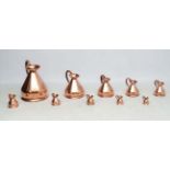 10 graduated copper measures of jug form, from 1/8 gill to 2 gallons.