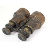 Militaria : A pair of WWI era leatherbound brass binoculars ,