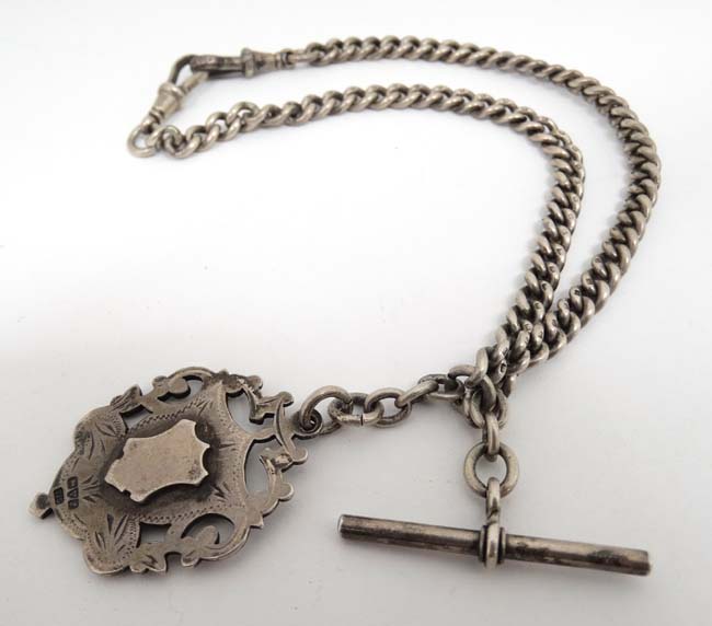 A silver albert watch chain with Hallmarked silver fob The fob Hallmarked Chester 1911 maker TJS.