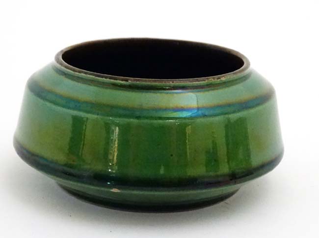 A small '' Watcombe '' Torquay green lustre pot, number 1476, bears inscribed mark to base.