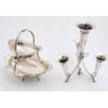 A silver plate 2 tier cake stand of dish form with loop handle 10 1/2" high together with a