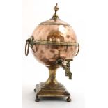 A 19thC copper and brass samovar of spherical form with loop handles and urn formed finial.