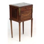 Lalaurette, Paris : A French inlaid mahogany marble topped bedside cabinet with ormolu mounts.