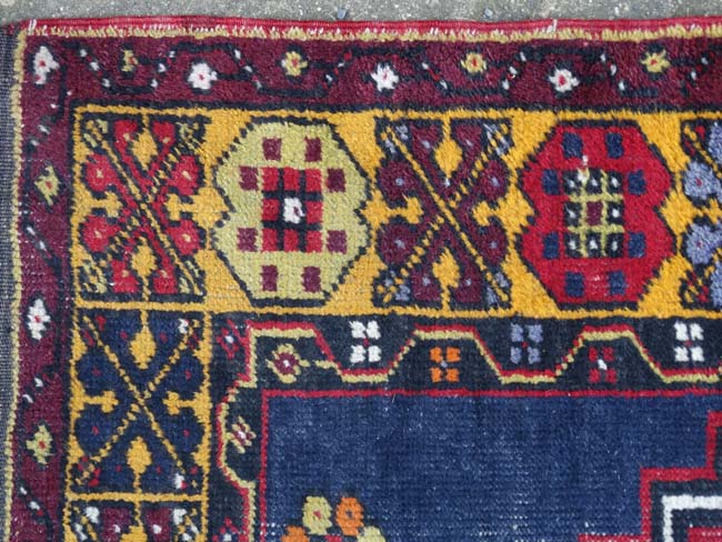 Rug / Carpet : A hand made woollen rug with blue ground, double medallion to centre and yellow , - Image 8 of 9