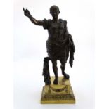 A patinated cast bronze figure of Caesar / Caeser on a gilt brass squared socle.