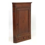 A Georgian shell inlaid oak and cross banded mahogany corner cupboard with one real and 2 sham