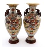 A pair of 20thC Japanese Satsuma style twin handled vases,