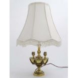 A mid 20thC brass and copper table lamp in the classical urn style with swage decoration.