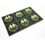 A set of six early 20thC Art Nouveau tube lined green Majolica lustre tiles decorated to centre