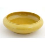 A Chinese Imperial yellow '' dragon '' bowl, decorated to exterior and centre with 5 clawed dragons,