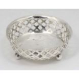 A silver bon bon dish of circular form with three ball feet and pierced decoration 3" diameter