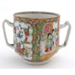 A 19thC Chinese export Cantonese famille rose 2 handled cup,