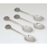 A set of 4 silver teaspoons the handles terminating in ' Society of Miniature Rifle Clubs' emblem,