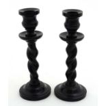 A pair of early 20thC ebony barley twist candlesticks each approx 7 1/8" high CONDITION: