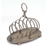 A large 7 bar toast rack with oval stand 8" wide x 7 1/2" high CONDITION: Please