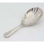 A silver caddy spoon with shell formed bowl hallmarked Sheffield 1920 maker Atkin Brothers and