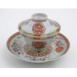 A Chinese tea cup with lid , each decorated in polychrome with 4 clawed dragons and phoenix,