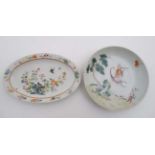 A small Chinese famille rose dish decorated in polychrome with birds and insects among flora,