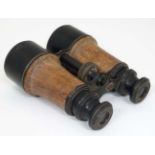 Militaria : A pair of WWI era leather bound brass binoculars by W .