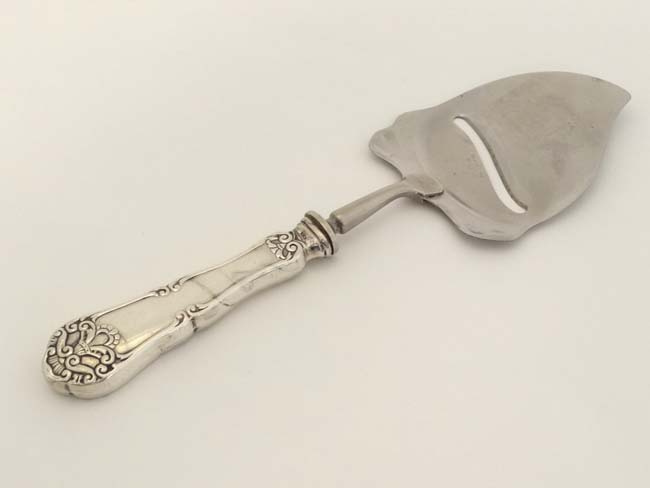 A Continental (.830) silver handled cheese slicer by Albert Scharning of Oslo Norway.