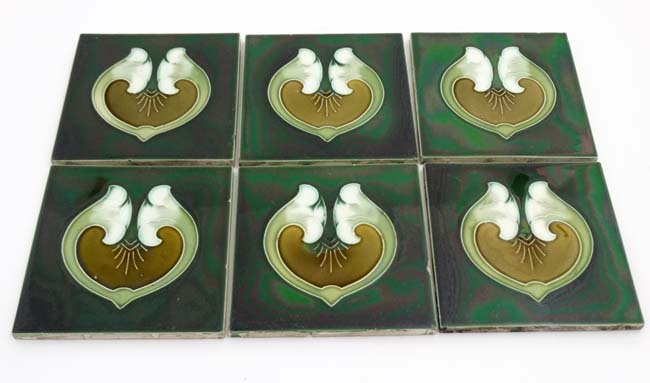 A set of six early 20thC Art Nouveau tube lined green Majolica lustre tiles decorated to centre - Image 3 of 3