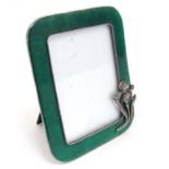 A late 20thC base metal photograph frame with green guilloché enamel like decoration with Art