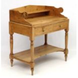 A Victorian stripped and waxed pine 2-door washstand 35 1/2" wide x 21 1/2" deep x 37 1/2" high