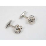 A pair of silver cufflinks with knot detail by Charles Tyrwhitt CONDITION: Please