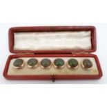 A cased set of 6 early 20thC gilt metal buttons set with sapphrite / agate like glass cabochon.