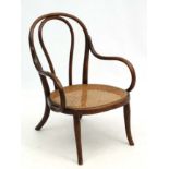 Thonet : A cane seated bentwood open armchair nursing chair. Labelled.