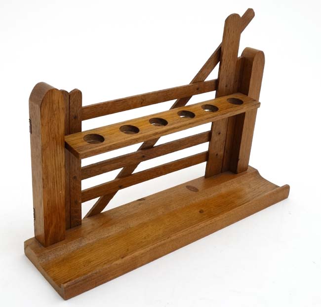 An early 20thC novelty pipe rack of 6 divisions formed as a gate 12" wide x 3" deep x 8" high