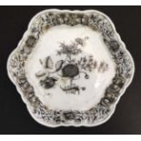 A small Oriental Black and white hexagonal dish decorated to centre with peony and other flora with