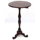 An early 19thC mahogany tripod table with turned pedestal and radiating veneers.
