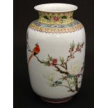 A 20thC Chinese famille rose vase decorated in polychrome enamels with exotic bird perched on a