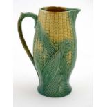 A late 19thC Majolica sweetcorn and leaf pattern jug, decorated in green and yellow ,