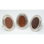 A set of three late 20thC Mexican silver oval photograph frames by PLAT MEX SA , Mexico City.