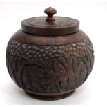 An Ethnic carved hardwood spherical pot with elephant am amongst tree decoration 5 1/4" diameter