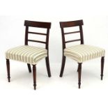 A pair of Geo V mahogany over stuffed dining chairs 32 3/4" wide CONDITION: Please