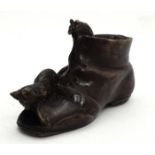 A late 20thC / early 21stC model of a bronze boot with a cat and a mouse CONDITION: