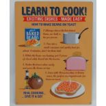 A 21stC Metal sign - 'Learn to cook - baked beans' CONDITION: Please Note - we do